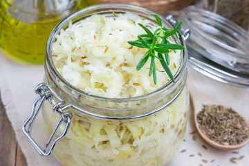 Homemade sauerkraut with cumin in a glass jar 