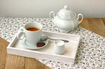 Obraz na płótnie Canvas Espresso in the cup with milk, biscuit and sugar basin