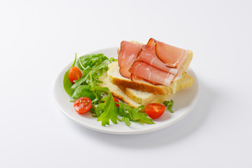 bread with ham and salad greens
