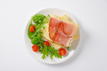 bread with ham and salad greens