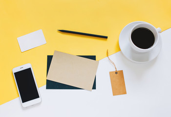 Creative flat lay photo of workspace desk with smartphone, coffe