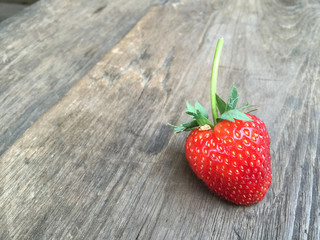 Fresh strawberries on old wooden background