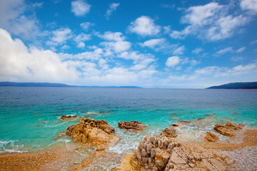 Small Adriatic coastline Croatia. Clear azure water under blue s