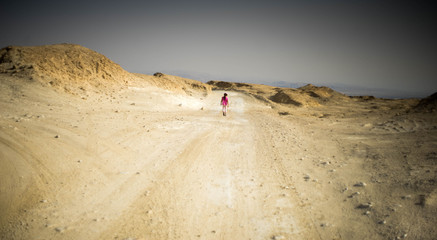 Family hiking in desert