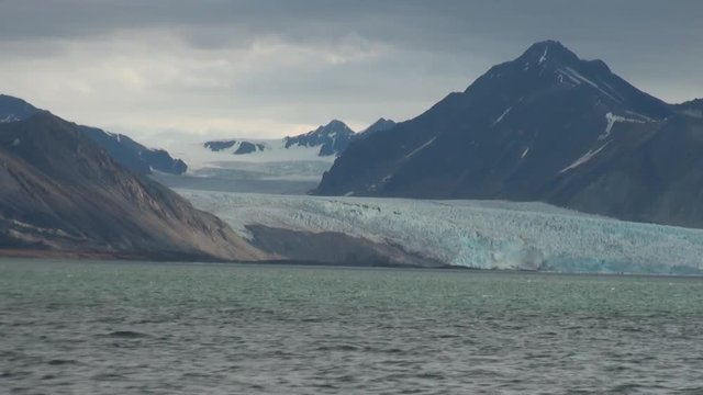 Snowy mountains and the sea in Arctic. Iceland. Fantastic wonderful amazing video grenland nature iceland. Lovely shooting the life of nature, seaside and mountains.