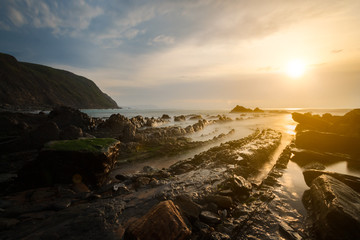 Flysch rocks in Barrika beach at the sunset, Basque Country, Spain
