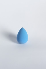 Blue beauty blender on a white background