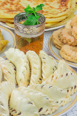 Bowl of Moroccan harira soup,chebakia, dates for iftar