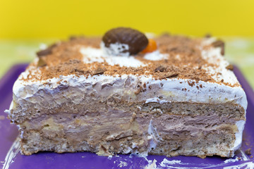 Sliced easter chocolate cake with easter egg on the top