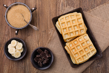 Delicious waffles with banana and chocolate