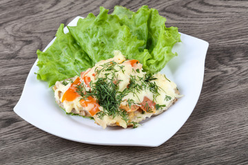 Meat covered cheese and tomato