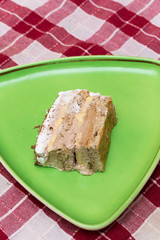 Piece of cake on the green plate