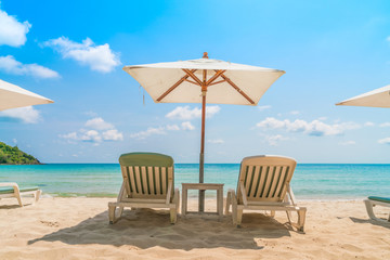Beach chairs on tropical white sand beach