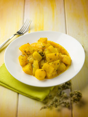 potatoes salad with saffron and oregano, selective focus