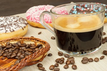 Fresh hot coffee and fresh donuts. Traditional sweets with coffee. Calorie junk food. Fresh unhealthy breakfast.

