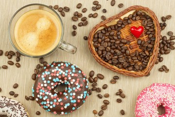 Fresh hot coffee and fresh donuts. Traditional sweets with coffee. Calorie junk food. Fresh unhealthy breakfast.
