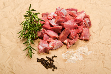 raw deer goulash with rosemary, pepper corn and kosher salt