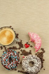 Fresh hot coffee and fresh donuts. Traditional sweets with coffee. Calorie junk food. Fresh unhealthy breakfast.
