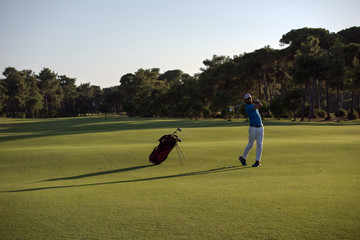 golfer hitting long shot