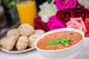 Bowl of Moroccan harira soup,chebakia, dates for iftar