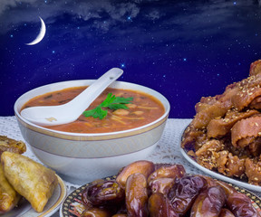 Bowl of Moroccan harira soup,chebakia, dates for iftar