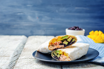 Salmon avocado mango black rice burritos