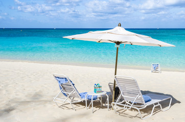 Parasol and Deckchairs on a Tropical Beach