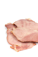 Sliced cooked smoked ham over white