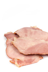 Sliced cooked smoked ham over white