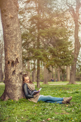 Young woman reading book