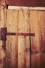 Wooden door with a metal hinge