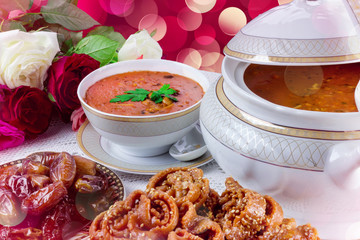Bowl of Moroccan harira soup,chebakia, dates for iftar