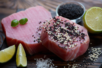 Close-up of two raw fresh tuna steaks, selective focus