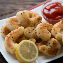 Close-up of fried panko breaded shrimps, selective focus