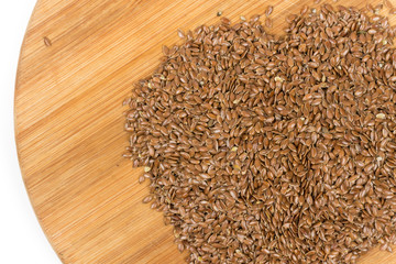 Flax seeds on the wooden board