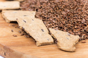 Flax seeds with flax snacks on the board