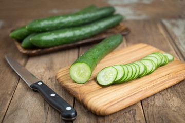 Cucumber on wood background.