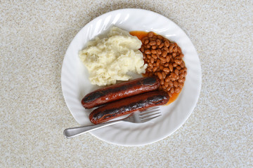 top view sausages baked beans and mashed potato