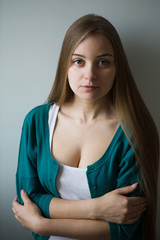 Portrait of the beautiful sad young woman with long hair
