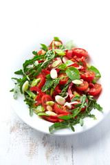 Cherry tomato and arugula salad with spring onion