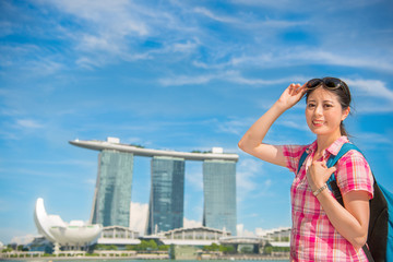 Fototapeta na wymiar Happy Asia woman Travel in Singapore, Marina Bay Sands Hotel