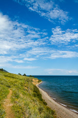 Fototapeta na wymiar Small trekking path at Baikal lake with blue skies