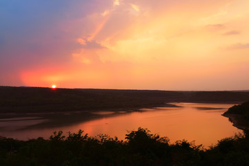 Fototapeta na wymiar Beautiful sunset over lake at Lam Ta Khong Reservoir