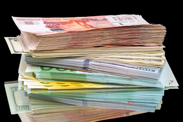 Stack of three types of currencies