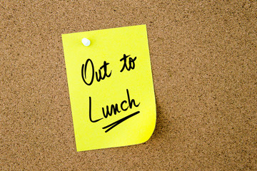 Out To Lunch written on yellow paper note