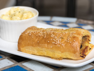  Sausage roll in white plate