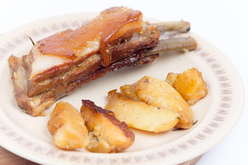Served pork ribs with potatoes