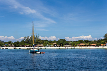 Fototapeta na wymiar Sailboat on tropical coastline at Lipe island, Thailand