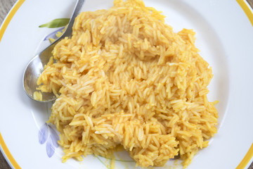 saffron rice with grated parmesan cheese