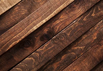 Deurstickers Dark wooden texture. Diagonal background brown old wood planks. © xamtiw